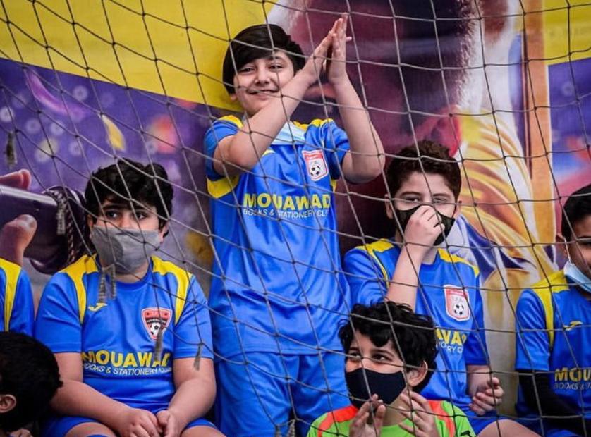 Players celebrating with medals